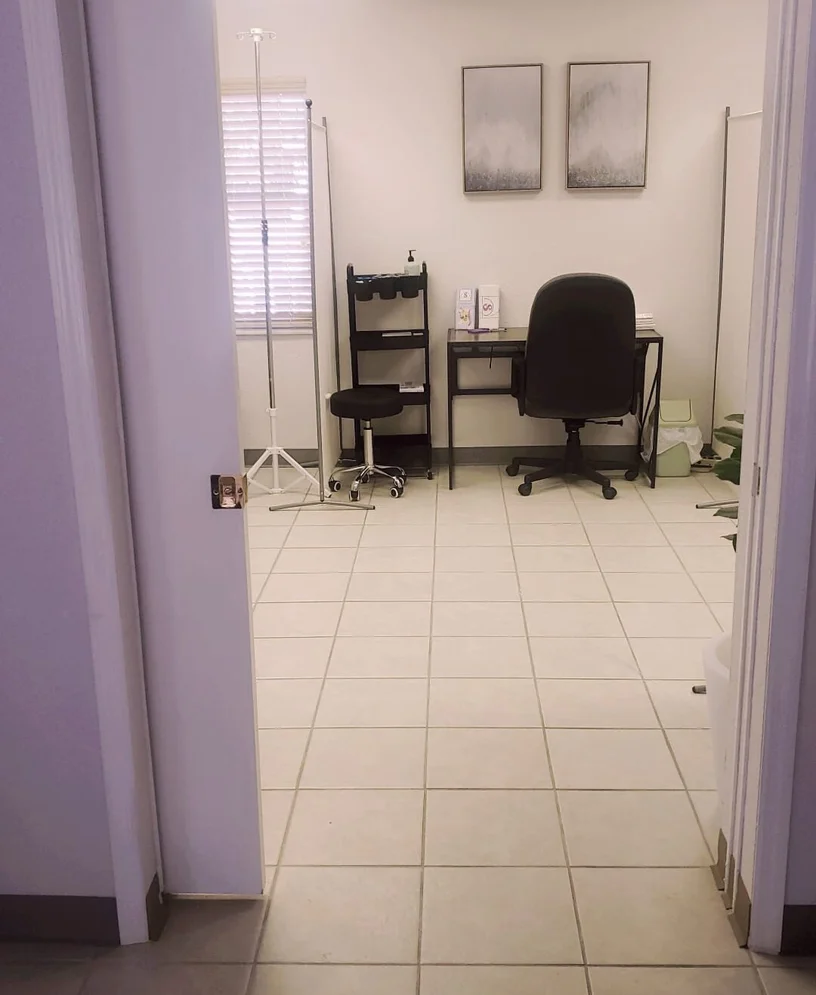 Supreme CHS patient care consultation room with IV stand and workspace