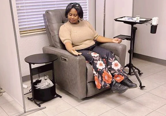 Patient relaxing in a comfortable recliner during an IV hydration session at Supreme CHS